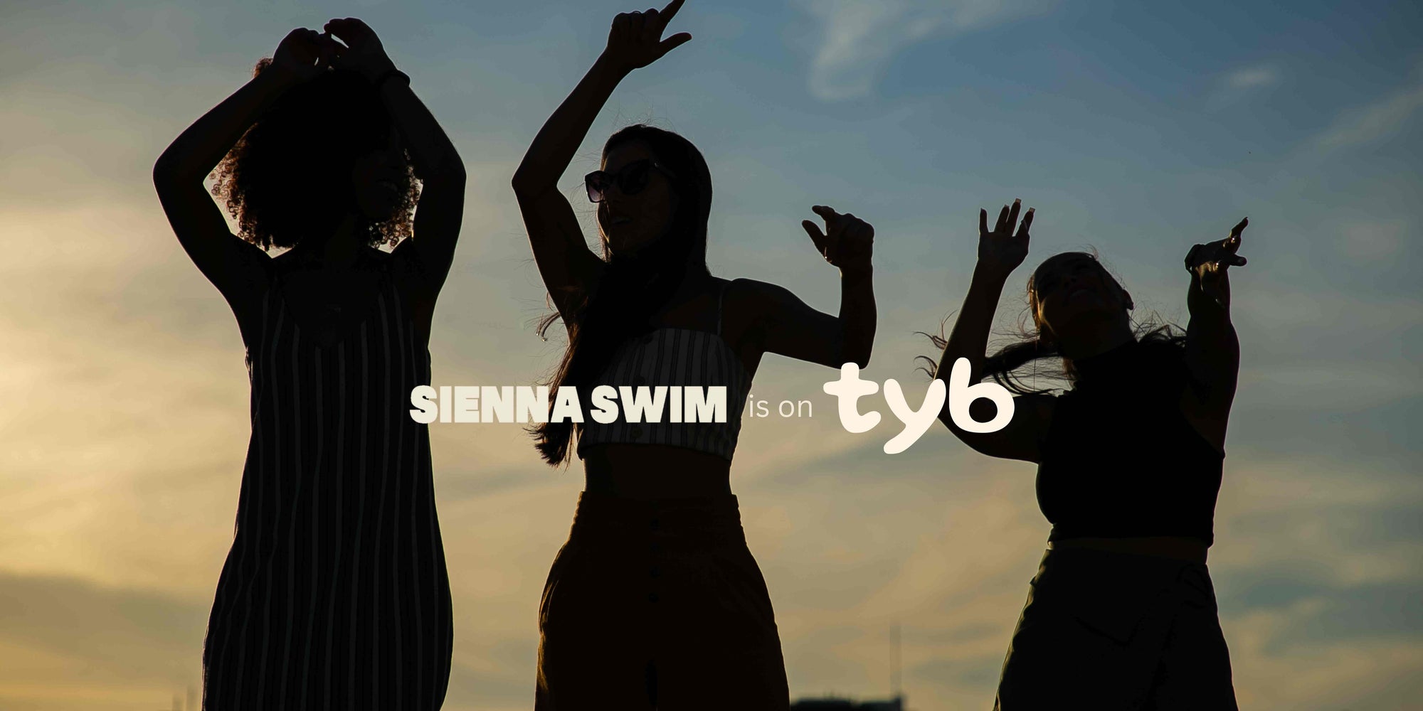 Three women standing together, with the text ‘Sienna Swim is on TYB’ overlaid on the photo